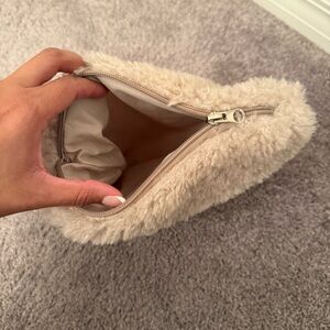 Cream faux fur makeup bag with zipper